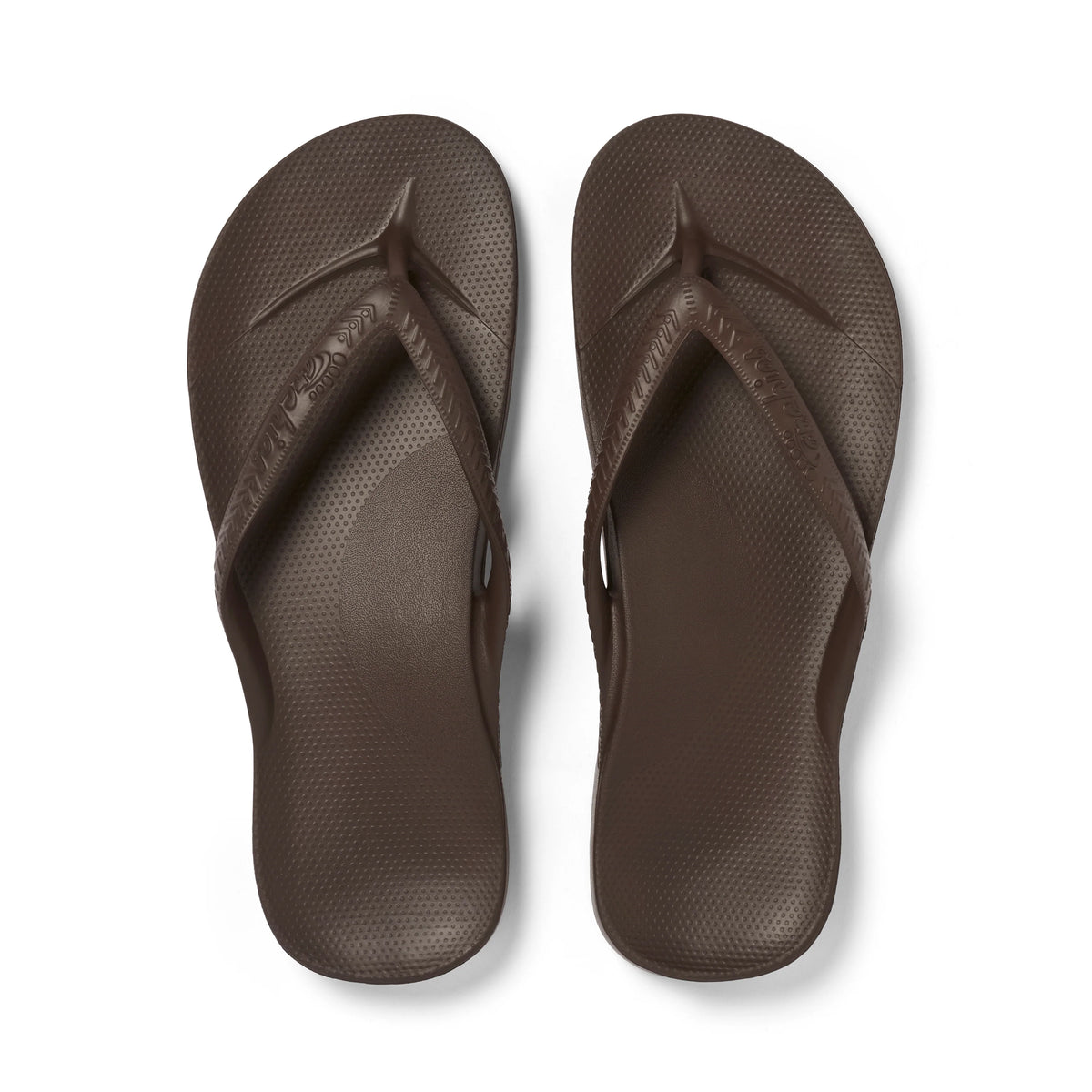 Brown Archies arch support thong footwear showing the comfortable footbed and supportive straps in a close-up view.