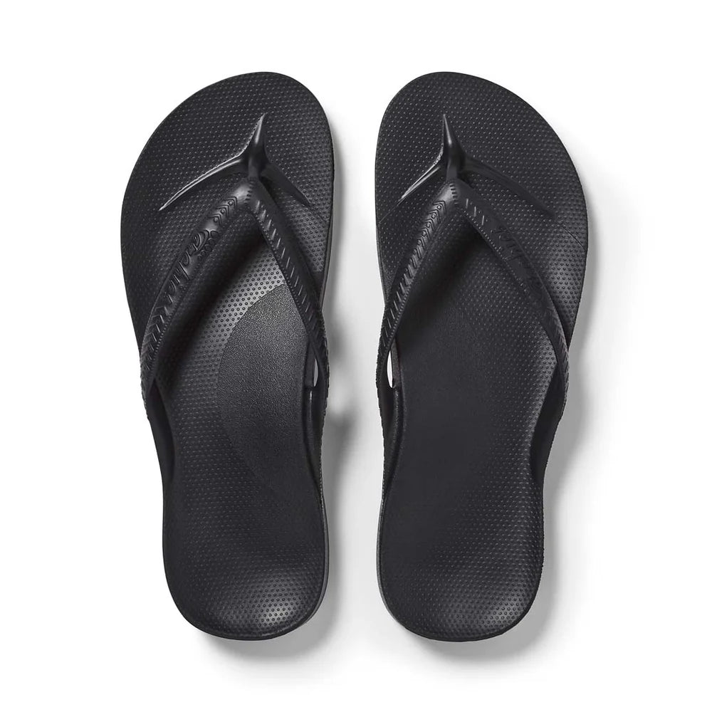 Black Archies arch support thong footwear with cushioned footbed and thong strap, designed for comfort and stability.