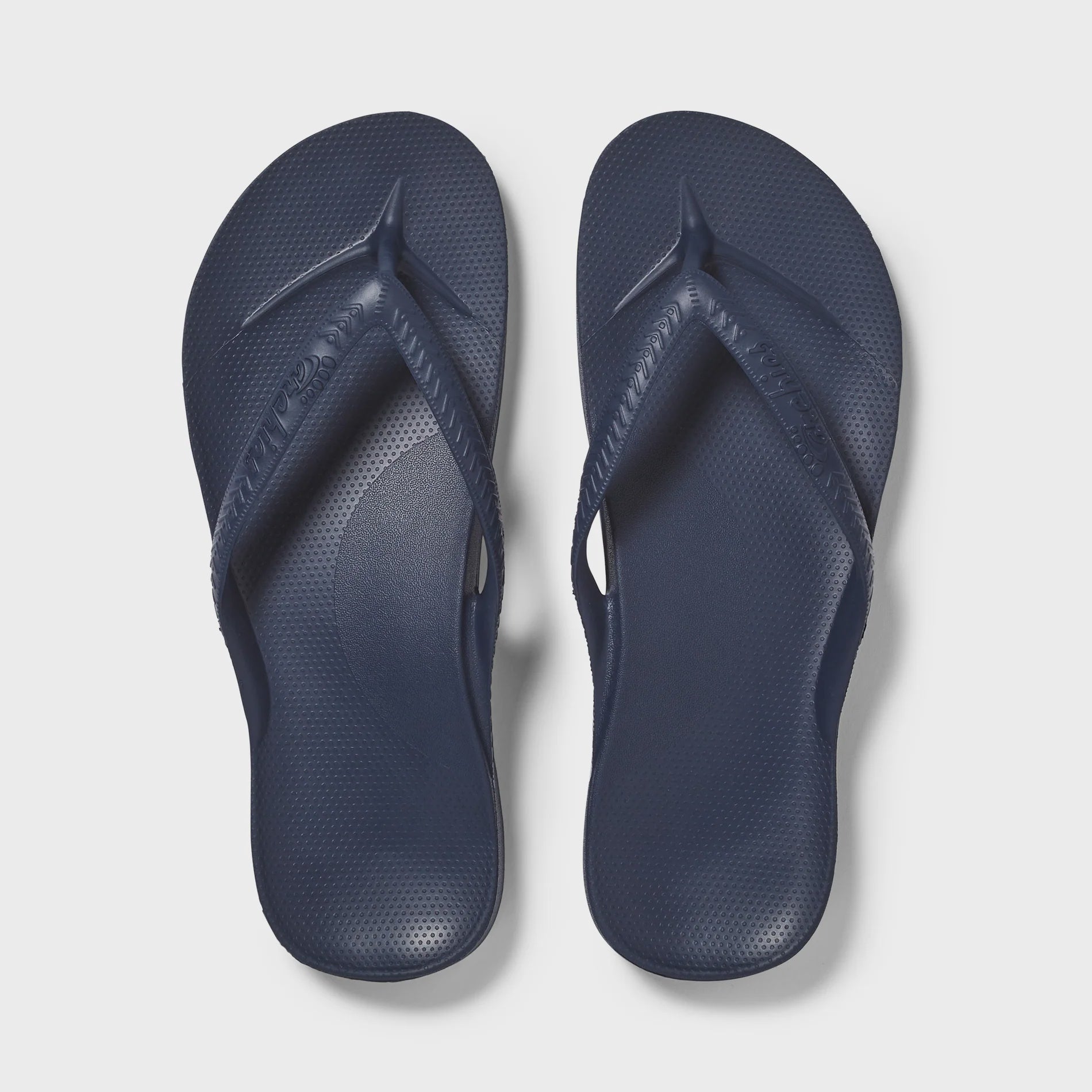 Hot pink Archies Arch Support Thong footwear with cushioned footbed and supportive straps, ideal for comfort and everyday wear.
