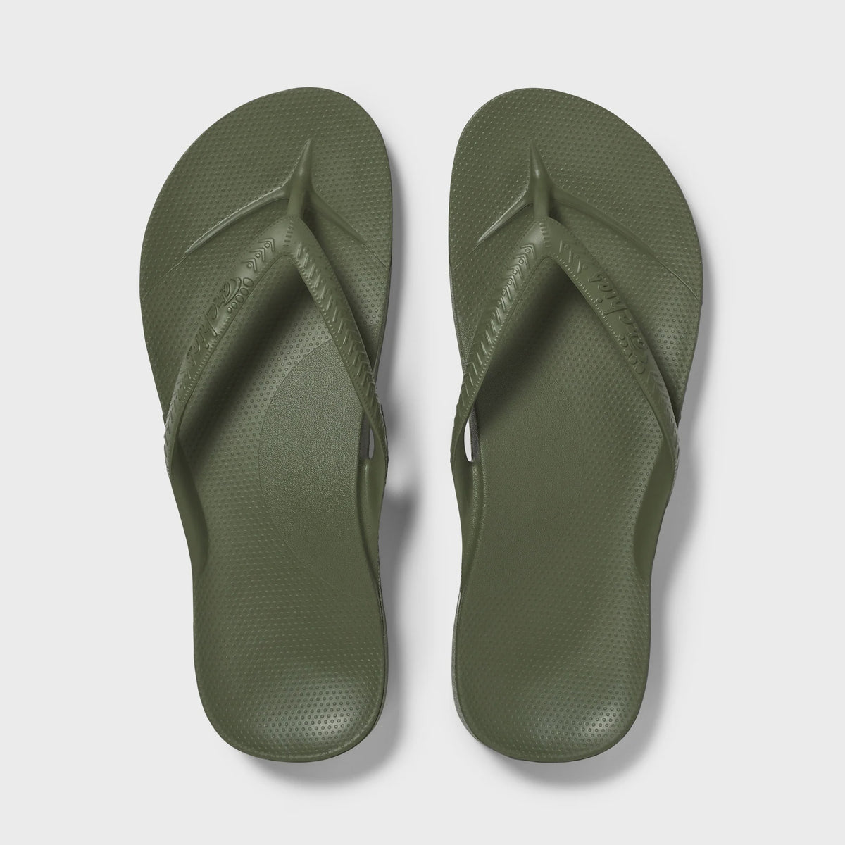 Hot pink Archies arch support thong footwear with cushioned footbed and thong strap for comfortable wear.