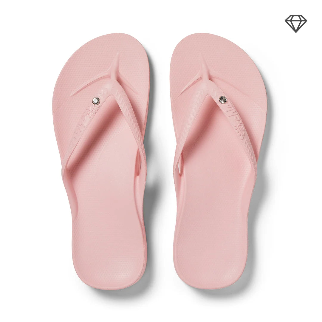 Crystal pink Archies arch support thong footwear with cushioned footbed and stylish design for comfortable wear.