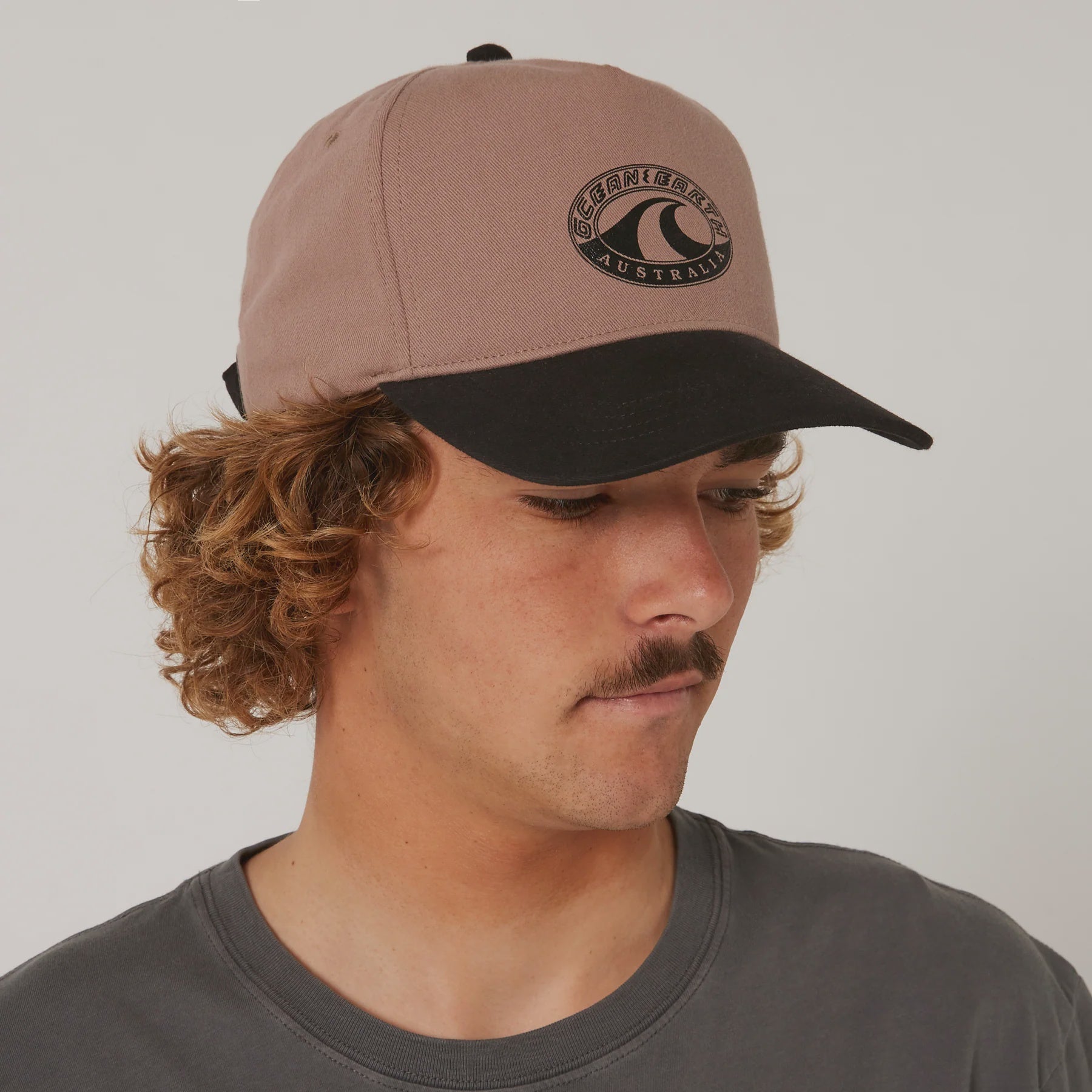 Ocean & Earth Wave Heritage Cap, a stylish hat with a mushroom wave design, perfect for casual wear and sun protection.